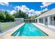 Long refreshing pool, surrounded by a deck at 4001 Cree Dr, Ormond Beach, FL 32174