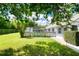 Relaxing pool area with pergola and lush landscaping at 4001 Cree Dr, Ormond Beach, FL 32174