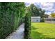 Landscaped walkway leading to a detached building at 4001 Cree Dr, Ormond Beach, FL 32174