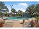 Inviting community pool with landscaping and seating area at 404 S Beach St # 304, Daytona Beach, FL 32114