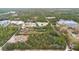 Wide shot of property, showing multiple homes and surrounding landscape at 42847 Cooter Pond Rd, Deland, FL 32720