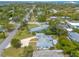 An aerial view of a house nestled in a neighborhood near the water at 469 S Halifax Dr, Ormond Beach, FL 32176