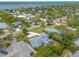 Aerial view of a home with a large yard and a water view at 469 S Halifax Dr, Ormond Beach, FL 32176