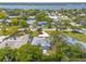 An aerial view showing a home with a large yard and water access at 469 S Halifax Dr, Ormond Beach, FL 32176