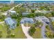 Aerial view of a single-Gathering home with a spacious yard and ocean views at 469 S Halifax Dr, Ormond Beach, FL 32176