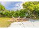 Charming backyard with firepit and patio area at 469 S Halifax Dr, Ormond Beach, FL 32176