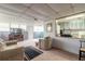 Finished basement with seating area and partial kitchen view at 469 S Halifax Dr, Ormond Beach, FL 32176