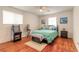Guest bedroom with hardwood floors and arcade game at 469 S Halifax Dr, Ormond Beach, FL 32176