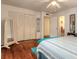 Bright bedroom with hardwood floors and built-in closet at 469 S Halifax Dr, Ormond Beach, FL 32176