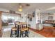 Dining area with a table and stools, open to the living room and kitchen at 469 S Halifax Dr, Ormond Beach, FL 32176