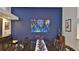 Elegant dining room with dark wood table and blue accent wall at 5 Cross Creek Way, Ormond Beach, FL 32174