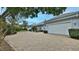 White two car garage with paver driveway at 5 Cross Creek Way, Ormond Beach, FL 32174