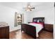 Spacious bedroom with a queen bed and ceiling fan at 501 W Lisbon Pkwy, Deland, FL 32720