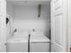Laundry closet with washer and dryer at 501 W Lisbon Pkwy, Deland, FL 32720