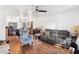 Living room with gray couch, blue armchair, and dining area at 501 W Lisbon Pkwy, Deland, FL 32720