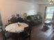 Comfortable living room and dining area with neutral tones and natural light at 501 W Lisbon Pkwy, Deland, FL 32720