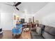 Living room with gray couch and blue armchair at 501 W Lisbon Pkwy, Deland, FL 32720
