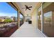 Covered screened porch with ceiling fan, extending the living space at 5579 Nw 40Th Pl, Ocala, FL 34482