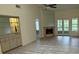 Spacious living area with a fireplace and access to a balcony at 596 N Nova Rd # 310, Ormond Beach, FL 32174