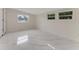 Clean and bright bedroom featuring plenty of natural light, tile floors, and closet at 681 N Halifax Dr, Ormond Beach, FL 32176
