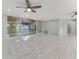 Spacious living area with sliding glass doors leading to the outdoor pool area at 681 N Halifax Dr, Ormond Beach, FL 32176