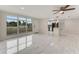 Bright living room with lots of natural light, with modern fixtures, tile floors, and an open-concept kitchen at 681 N Halifax Dr, Ormond Beach, FL 32176