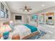 Spacious main bedroom with a ceiling fan and a glass sliding door that provides access to outdoor living spaces at 681 N Halifax Dr, Ormond Beach, FL 32176