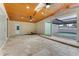Spacious sunroom with travertine floors, wood ceilings, skylights, and access to a screened-in pool at 681 N Halifax Dr, Ormond Beach, FL 32176
