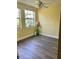 Cozy bedroom features bright natural light and contemporary flooring for a peaceful retreat at 701 Perkins St # 100, Leesburg, FL 34748