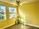 Bright bedroom with large windows and ceiling fan at 701 Perkins St # 100, Leesburg, FL 34748
