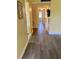Hallway features modern flooring and flows seamlessly through the home's living spaces at 701 Perkins St # 100, Leesburg, FL 34748