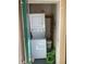 Practical laundry area with stacked washer and dryer unit, providing convenient in-home laundry solutions at 701 Perkins St # 100, Leesburg, FL 34748