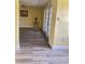Bright living room with modern flooring and access to a private outdoor area through double doors at 701 Perkins St # 100, Leesburg, FL 34748