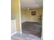 Spacious living room features updated flooring and neutral paint, perfect for relaxing or entertaining at 701 Perkins St # 100, Leesburg, FL 34748