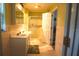 Clean bathroom with double vanity and shower/tub combo at 718 N Florida Ave, Deland, FL 32720