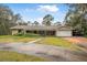 Single story home with attached garage and circular driveway at 746 Laverna Dr, Daytona Beach, FL 32117