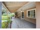 Covered porch with seating area, creating an inviting entryway at 746 Laverna Dr, Daytona Beach, FL 32117