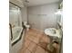 Bathroom with pedestal sink, toilet and corner bathtub at 8101 Via Bonita St, Sanford, FL 32771