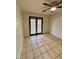 Bedroom with tile floors and sliding glass doors at 8101 Via Bonita St, Sanford, FL 32771