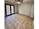 Bedroom with tile floors and sliding glass doors at 8101 Via Bonita St, Sanford, FL 32771