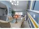 Open-concept with chandelier in dining room, that flows into the living room at 878 Abbott Ave, Deltona, FL 32725