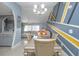 Open-concept with chandelier in dining room, that flows into the living room at 878 Abbott Ave, Deltona, FL 32725