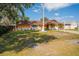 Single Gathering home with an orange stucco and white brick exterior and a well maintained front lawn at 878 Abbott Ave, Deltona, FL 32725
