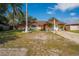 Single Gathering home with an orange stucco and white brick exterior and a well maintained front lawn at 878 Abbott Ave, Deltona, FL 32725