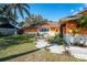 Inviting home featuring a landscaped front yard with a sidewalk and stylish accents at 878 Abbott Ave, Deltona, FL 32725