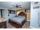 Spacious main bedroom featuring decorative wall art, a ceiling fan, and wood-look flooring at 878 Abbott Ave, Deltona, FL 32725