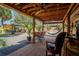 Outdoor living is emphasized by this covered patio with ceiling fans and brick flooring at 878 Abbott Ave, Deltona, FL 32725