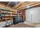 Garage with shelving, toolboxes, and workbench at 951 Torchwood Dr, Deland, FL 32724