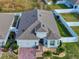 Single-Gathering home with a two-car garage and brick driveway at 962 Compass Landing Dr, Orange City, FL 32763