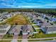 Community overview showcasing a variety of homes and open space at 962 Compass Landing Dr, Orange City, FL 32763